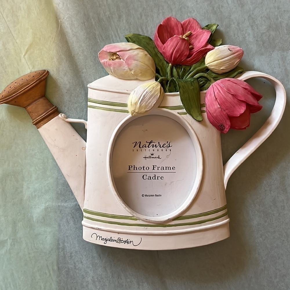Photo frame in pitcher . New